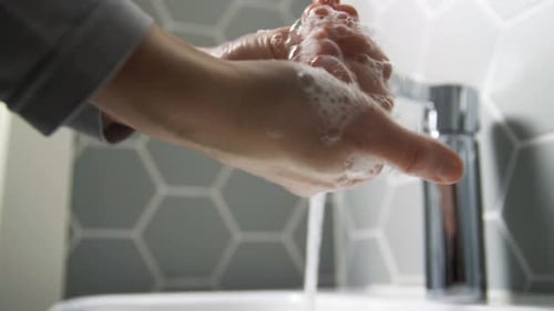 Close Up of Woman Washing Hands with Soap Foam