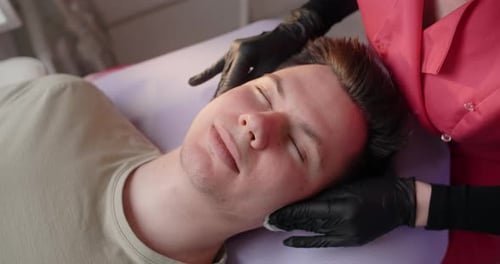 Beautician Wipes a Man's Face with Sponges Face Care at the Beauty Salon 60p Prores HQ