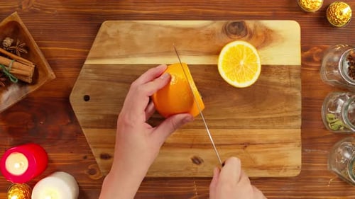 Woman Cutting Oranges Top View