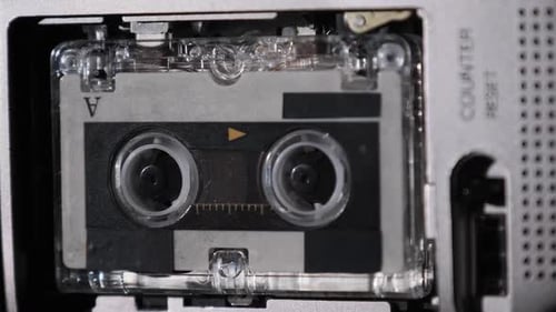 The Microcassette Spins in a Portable Handheld Recorder Tape Retro Player