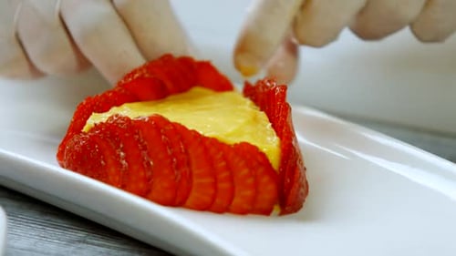 Hands Touch Strawberry Slices.