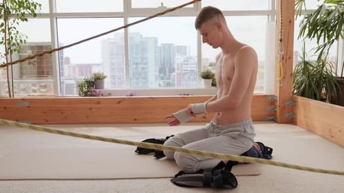 Man Putting On Equipment On Hands