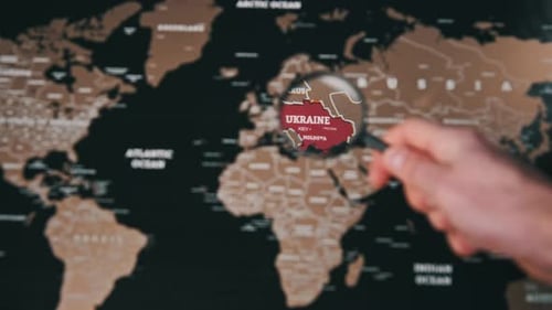 Ukraine on the World Map Under Magnifying Glass