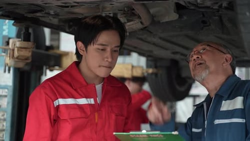 technician man car mechanic working in automotive garage to fix repair suspension auto car