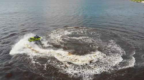 Water Sports a Man Riding the Yellow Jet Ski Aerial View
