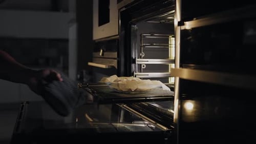 Chef Puts Rolls with Bacon and Chicken To the Oven for Roasting, Cooking Meat Into the Oven