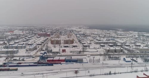 Sovetskiy city. Railway station and the trains. Aerial. Winter, snow 01