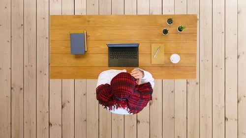 Arabian in Muslim Traditional Clothes Sitting in Office Using Laptop