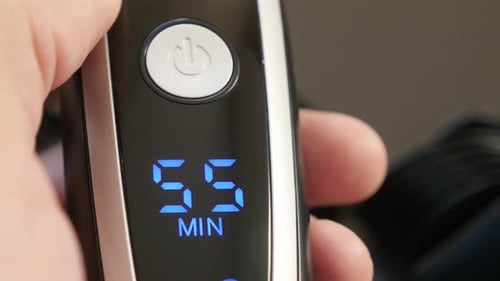 Shiny modern multi-cut clipper with LED display close-up 4K 2160p 30fps UHD footage - Cordless batt