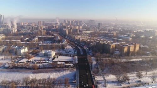Winter City with Residential Buildings Plants and Avenue