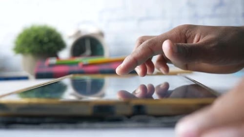 Child Hand Pointing Finger on Digital Tablet Screen