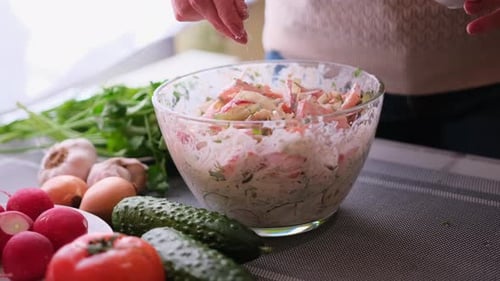 Closeup of Woman Slicing Dill on Wooden Cutting Board Preparing Ingredient for Meal