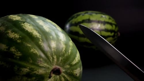 Watermelon with Knife and Black Background
