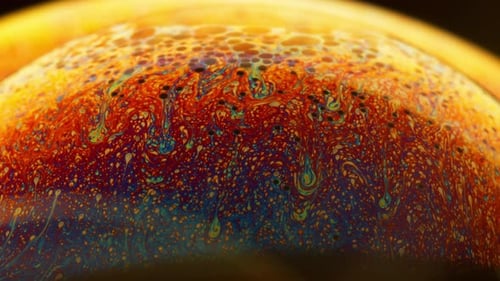 Abstract Macro Shot Fluid in Colorful Spectrum Swirling on the Surface