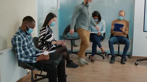 Multiethnic Applicants Waiting in Lobby to Enter Job Interview Meeting