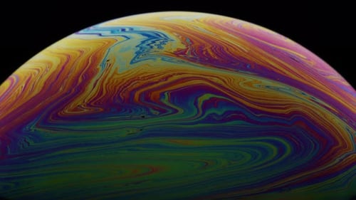 Macro Abstract Shot of Colorful Swirls on Liquid Soap's Film Surface