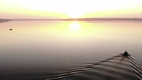 Aerial View of Boats with Fishermen on the Huge Surface of the Lake in the Rays of the Summer
