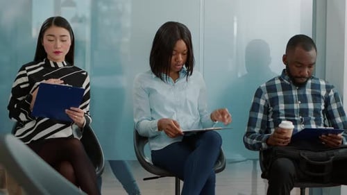 Diverse Group of Candidates Waiting in Line to Meet with HR Team