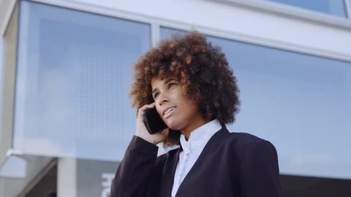 Businesswoman Ending Smartphone Call And Smiling