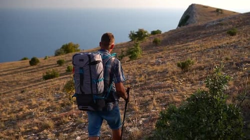 Travel Mountain Hike Back View of Male Hiker is Walking Along Rocky Area on an Autumn Day Spbd
