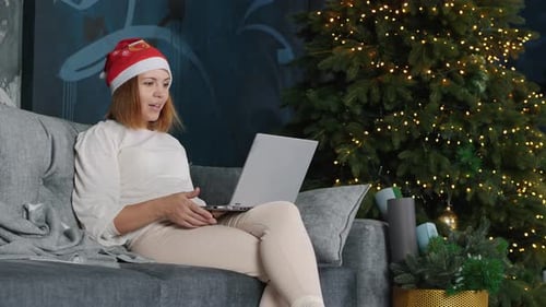 Young Woman Having a Video Call Online on Christmas Eve