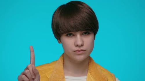 Woman Gesturing with Finger and Shaking Head for Saying No