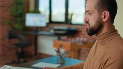 Businessman Working on Computer to Plan Financial Statistics