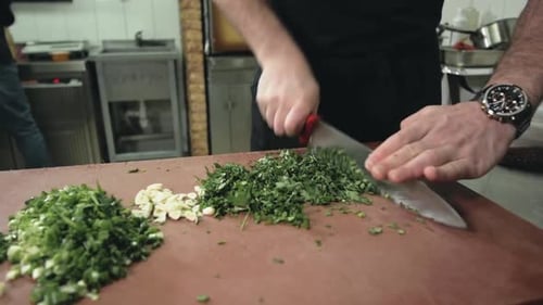 Chef Cooking Food on Kitchen Man Male Knife Preparation Green in Restaurant