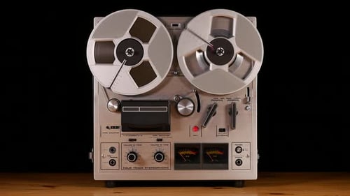 Vintage Reel to Reel tape recorder playing music
