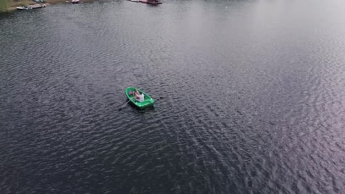 Top View of a Young Girl and a Man in a Boat on the River During a Summer Walk in Nature