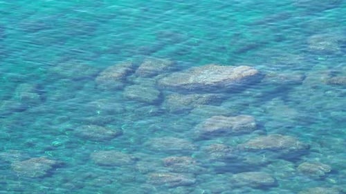 Clear sea water and reef. Transparent ocean, blue tropical seascape. Turquoise surface, coral stones