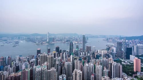 Timelapse of city skyline from day to night in hong kong china