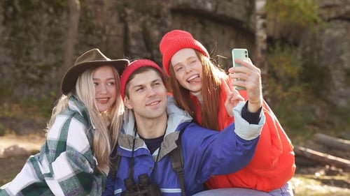 Young People Enjoy Spending Time in Forest After Climbing Mountains