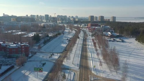 Winter Cityscape with Cars on Avenue and Apartment Buildings