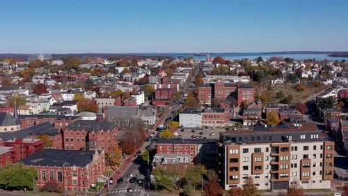 Drone flying towards the residential East End in Portland, Maine with the ocean in the background
