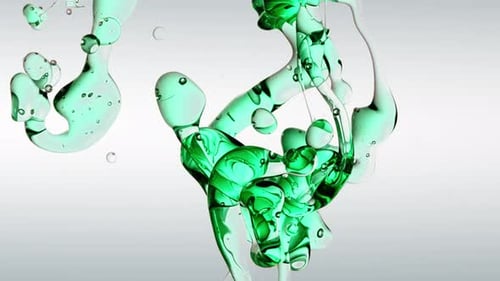 Transparent Cosmetic Green Blue Oil Bubbles and Shapes on White Background