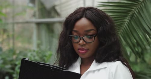 Portrait of a Female Scientist Analyzes the Data and Writes