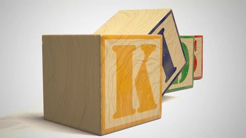 Blocks with colorful letters. Toys used to teach children spelling and writing.