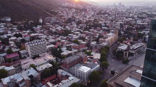 Sunset City And Glass Skyscraper