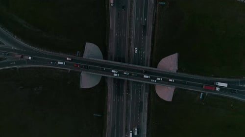 Night Aerial View of Highway and Overpass in City.