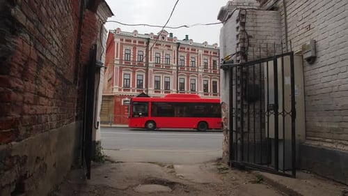 Motion Along Old Lane to Street Against Vintage Building