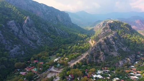 Road and Houses in Rocky Mounains Valley