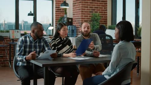 Diverse Group of Workers Attending Job Interview Meeting with Applicant