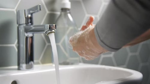 Close Up of Woman Washing Hands with Liquid Soap