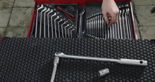 Auto Mechanic Opens A Box With Working Tools For Repair And Diagnostics Of Cars.