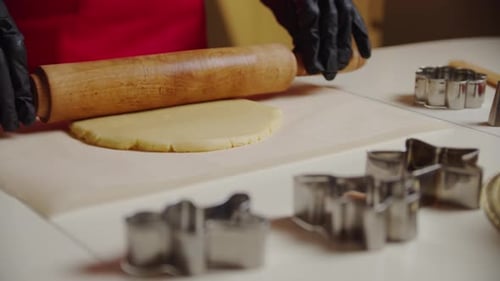 Rolls Out the Dough on the Kitchen Table