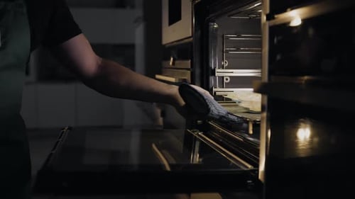 Chef Puts Rolls with Bacon and Chicken To the Oven for Roasting, Cooking Meat Into the Oven