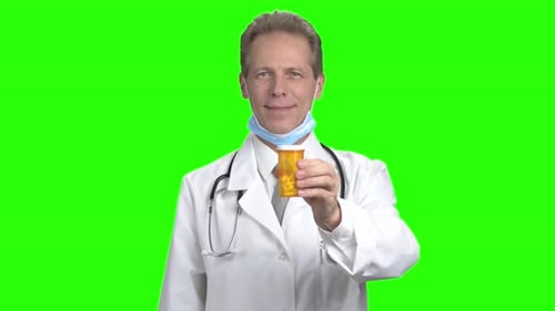 Mature Doctor Advertising Can of Pills