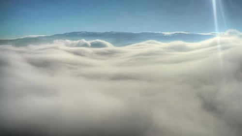 8K Above The Clouds From Mountain Summit
